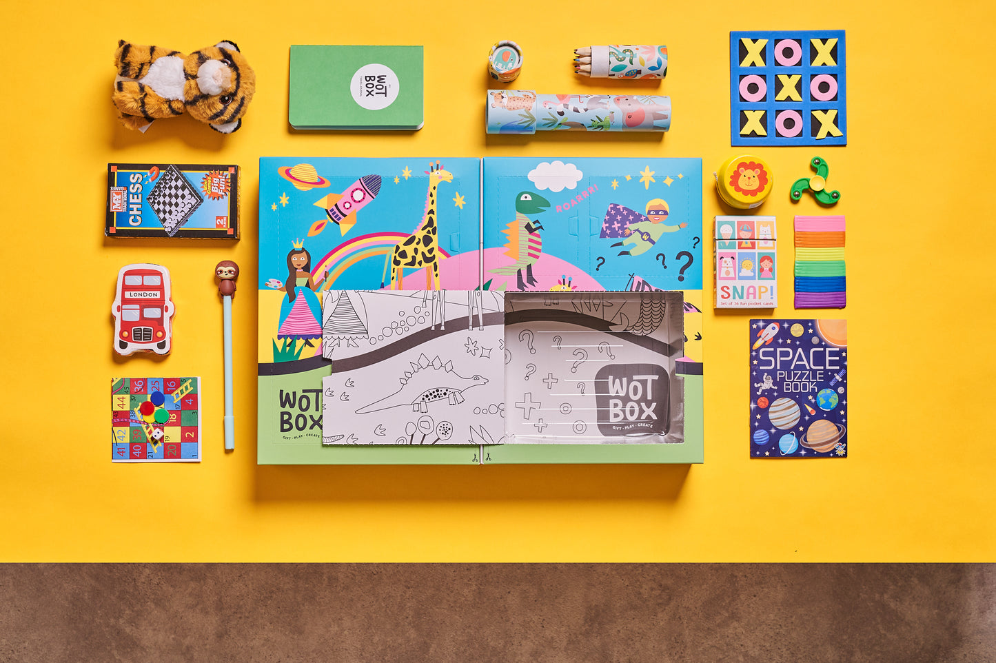 WOTBOX travel and adventures kids gift box. Birds eye shot of the gift box and its contents