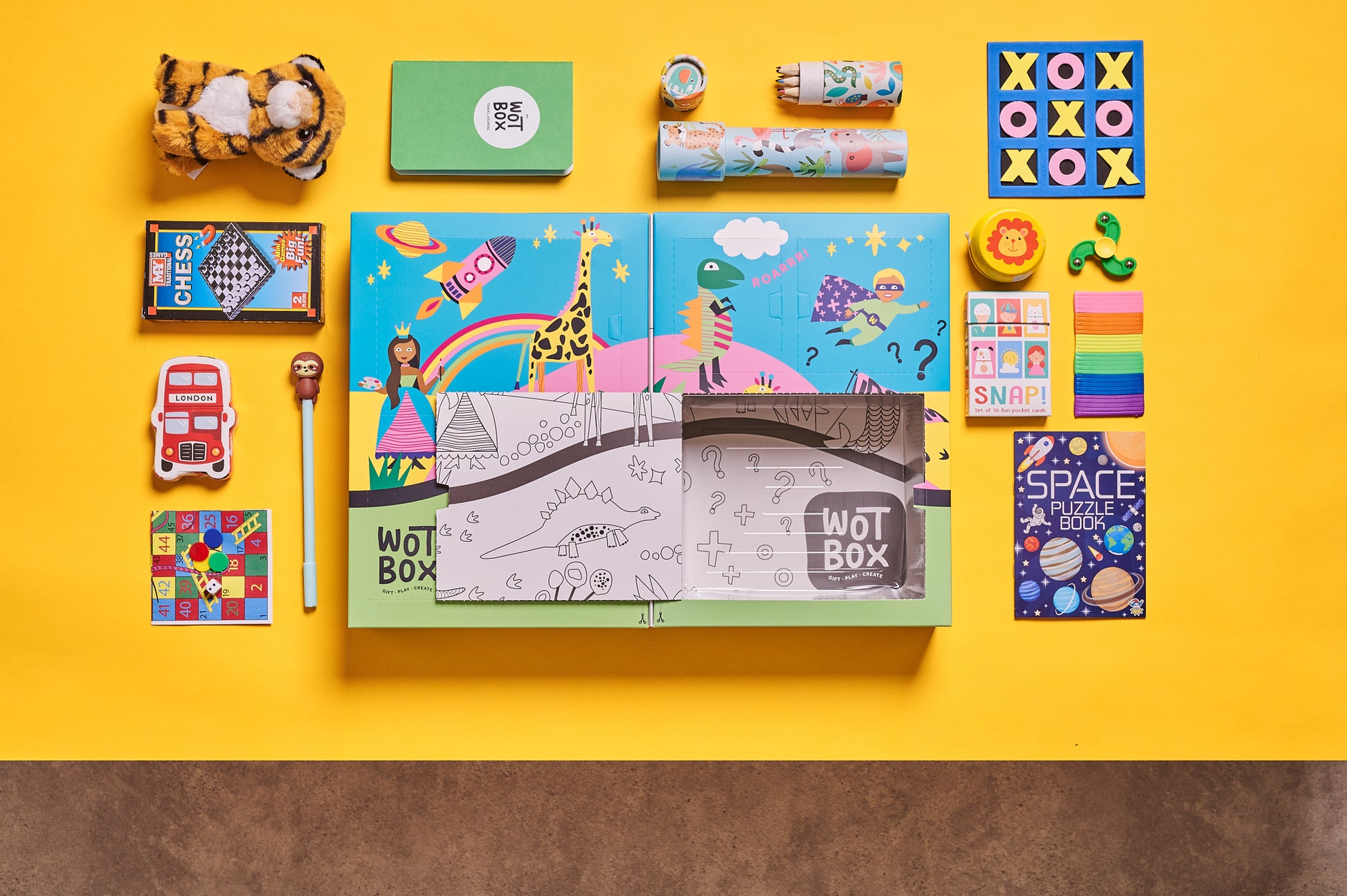 WOTBOX travel and adventures kids gift box. Birds eye shot of the gift box and its contents