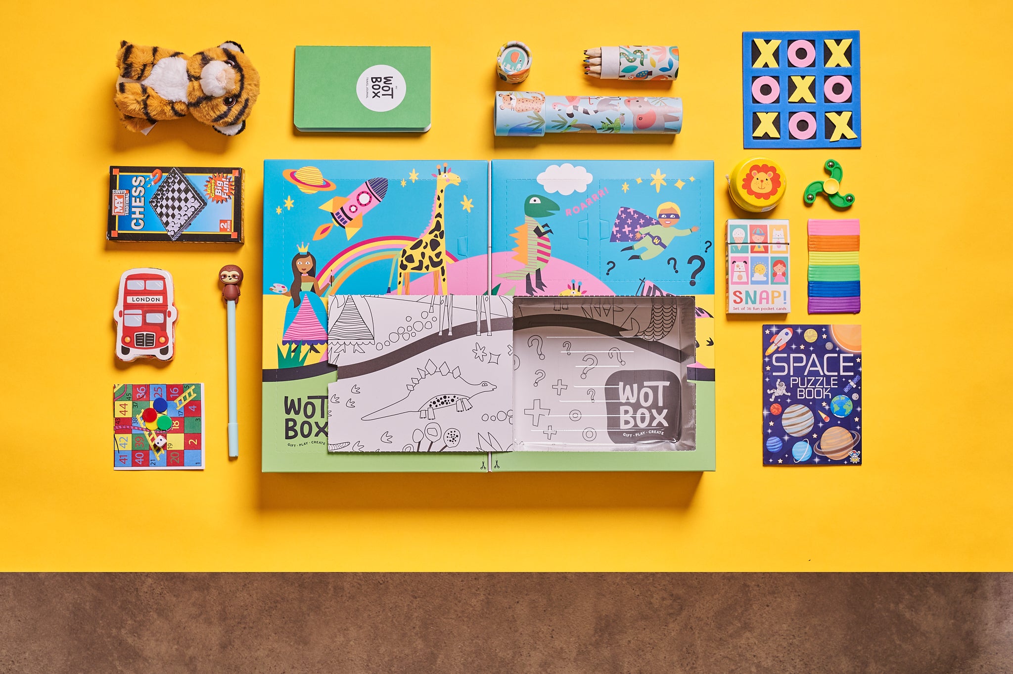 WOTBOX travel and adventures kids gift box. Birds eye shot of the gift box and its contents